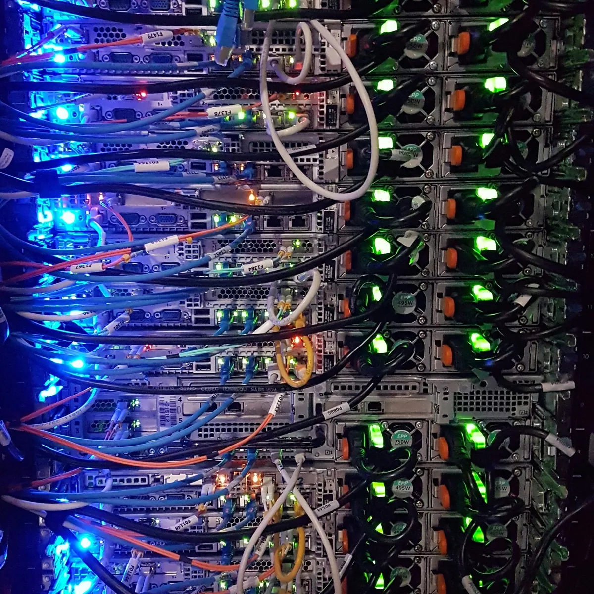 Power supplies, cabling and connections at the rear of a server rack